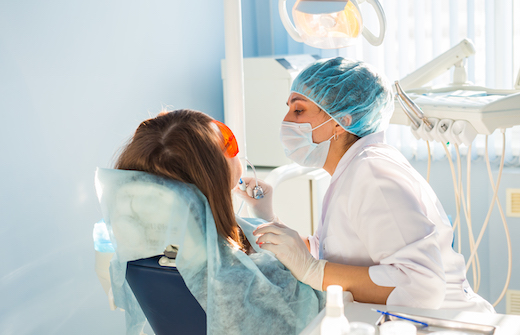 Young woman getting dental treatment. dental clinic